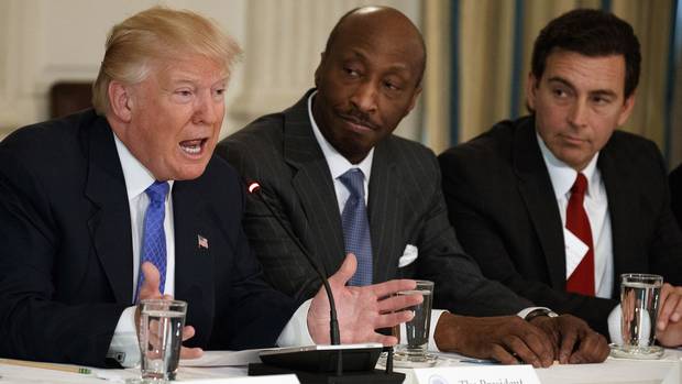 In this Thursday, Feb. 23, 2017, file photo, President Donald Trump, left, speaks during a meeting with manufacturing executives at the White House in Washington, including Merck CEO Kenneth Frazier, center, and Ford CEO Mark Fields.