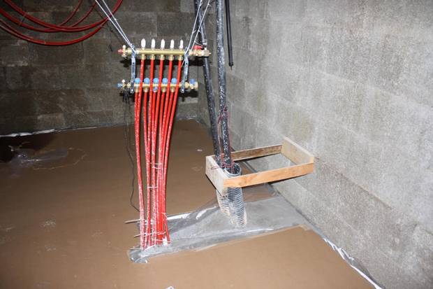 The interior hookups of the geothermal heating system in Alleyne's home.