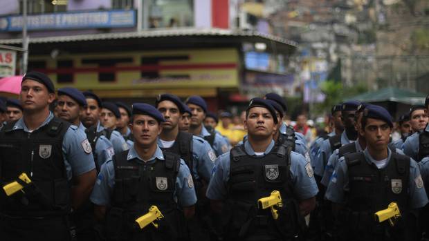 Policemen stand in line during the inauguration of the Peacekeeping Unit Program (UPP) in Rio de Janeiro’s Rocinha slum on Sept. 20, 2012.
