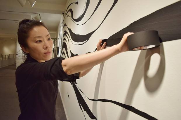 Kwak uses black masking tape as a medium and that has now become her signature style. Her latest work spans 24 metres of previously blank walls.