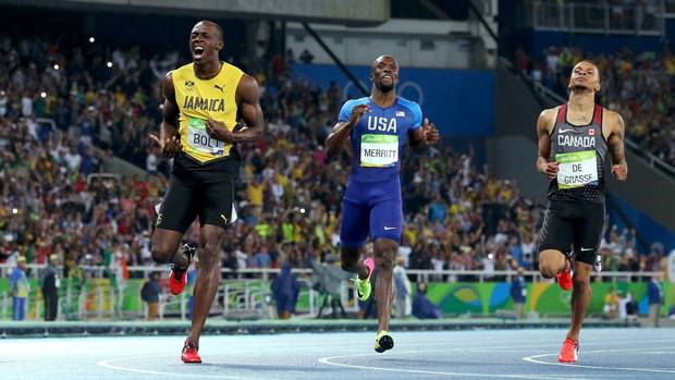 Usain Bolt of Jamaica reacts as he finishes ahead of Christophe Lemaitre of France, LaShawn Merritt of the United States and Andre De Grasse of Canada.