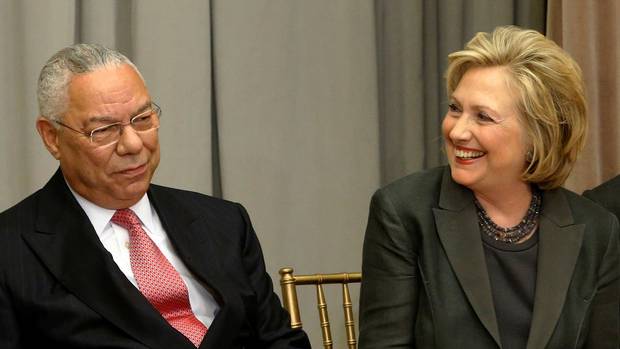 Former U.S. Secretaries of State Colin Powell and Hillary Clinton are shown on Sept. 3, 2014.