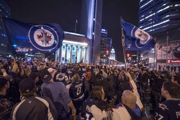 2015: Fans of the revived Winnipeg Jets team gather at Portage and Main to celebrate the team clinching an NHL playoff spot.