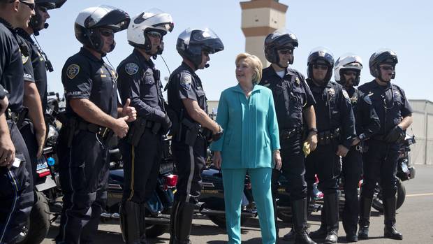Ms. Clinton greets members of law enforcement who escorted her motorcade before leaving Reno.