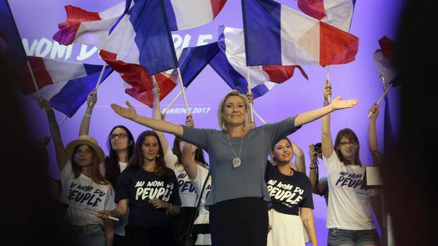 France's far-right National Front president Marine Le Pen, waves to supporters during the summer meeting, 'Les Estivales de Marine Le Pen', in Frejus, southern France, Sunday, Sep. 18, 2016.