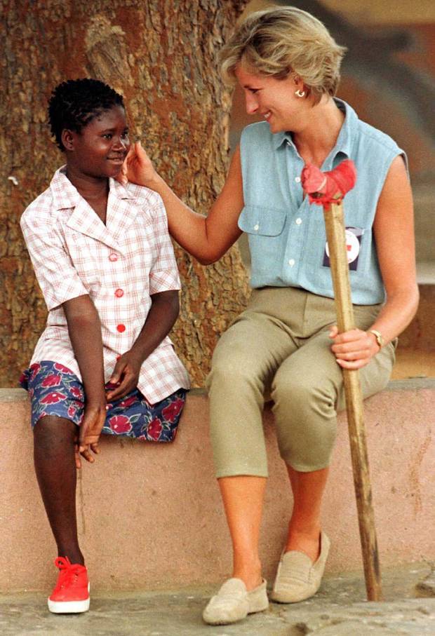 Diana, Princess of Wales, spends time with 11-year-old Sandra Tigica, January 14, the youngest patient at the Neves Bendinha orthopaedic center outside the Angolan capital Luanda, during a four-day visit to the southern African country. Young Sandra lost her leg in an air raid in 1994.