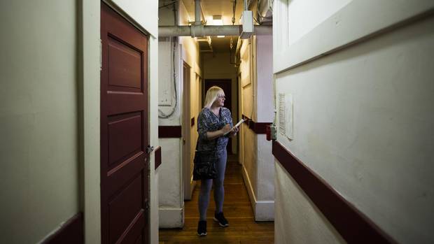 Cindy Bell, who is part of Atira's peer support program, conducts her weekly rounds at the Astoria Hotel, a single-room occupancy residency in Vancouver's Downtown Eastside.