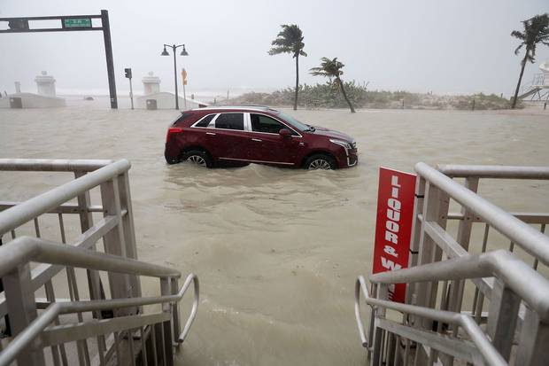 Fort Lauderdale, Fla., Sept. 10: A car sits abandoned in storm surge.
