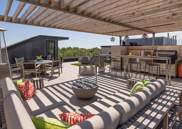 The owners have made extensive use of the rooftop terrace, grilling year-round.
