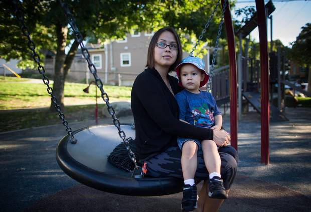 Crystal Saint Marie Howard sits with her son Ka'leo Stonechild, 3, at a park near their home in Vancouver.