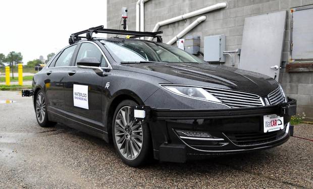 The Waterloo Centre for Autonomous Research self-driving car sits idle on a test road near the University of Waterloo campus in September, 2016.