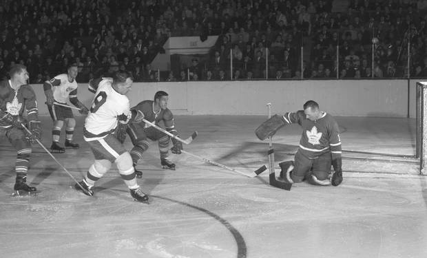 Gordie Howe of the Detroit Red Wings (#9) fires a shot at Toronto Maple Leafs goaltender Johnny Bower during action on March 26, 1966, at Maple Leaf Gardens. Bower led the NHL in goals against average in the 1965-66 season.