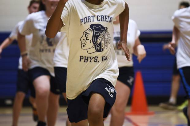 Students at Port Credit Secondary School in Mississauga wear the school T-shirts during gym class on May 2. The team will continue to be called the Warriors next fall, but the logo will be changed.