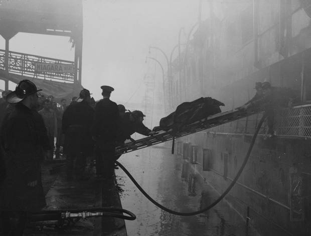 Emergency personnel in Toronto remove victims of the SS Noronic fire on Sept. 17, 1949.