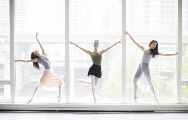 Greta Hodgkinson (L), Sonia Rodriguez (C) and Xiao Nan Yu (R), and pose for a picture at a studio inside the Walter Carsen Centre at the National Ballet of Canada, in Toronto, Friday May 26, 2017.