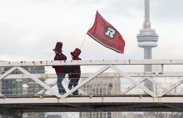 Ottawa Redblacks fans arrive before the Grey Cup game in Toronto on Sunday.