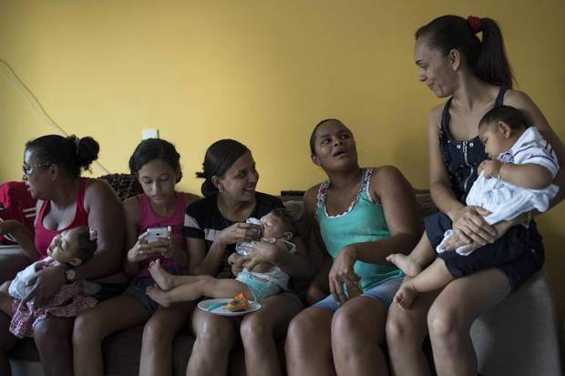 Mothers and friends hold their babies, born with microcephaly, one of many serious medical problems that be caused by congenital Zika syndrome, on Oct. 1, 2016 in Recife, Pernambuco state, Brazil.