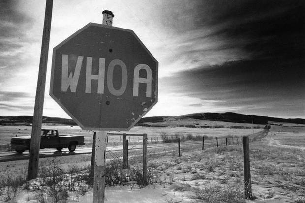 Prairie drive, somewhere between the Alberta border and Moose Jaw, Sask., 1990. The sign says it all. I purposely timed the photograph so the telephone pole obscured the pickup truck. That felt like the right thing to do at the time.
