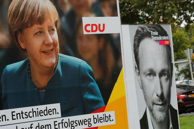 Election campaign posters show Ms. Merkel and Christian Lindner, the leader of Germany's Free Democratic Party, in Bonn, Germany.