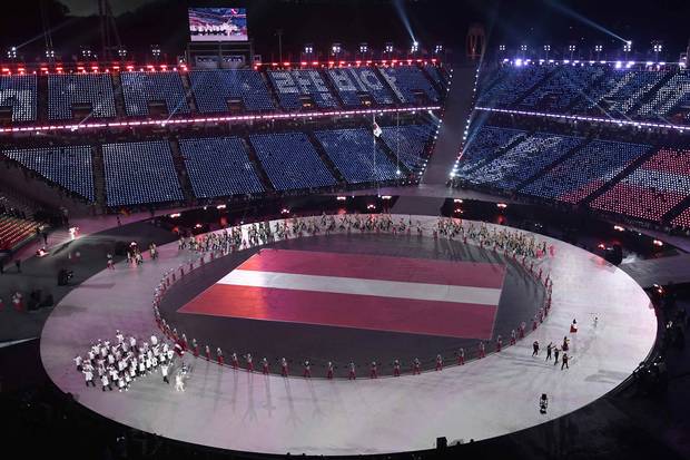 Latvia’s athletes arrive at the opening ceremonies.