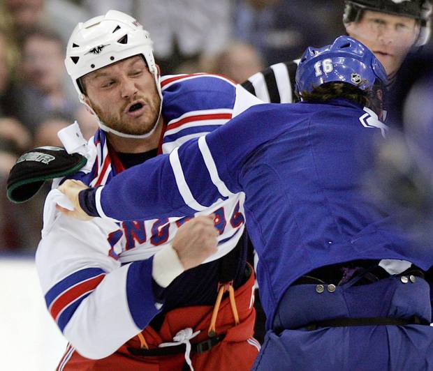 New York Rangers forward Sean Avery, left, fights with Darcy Tucker of the Toronto Maple Leafs during a game in November, 2007.