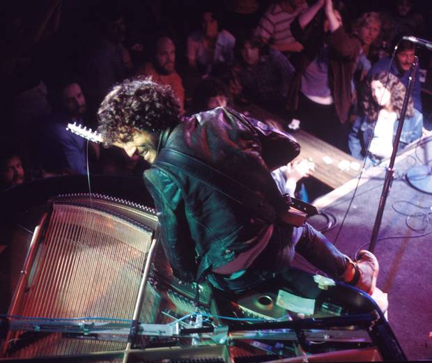 In this photo released by Shorefire Media, a young Bruce Springsteen performs at New York Citys Bottom Line in 1975.