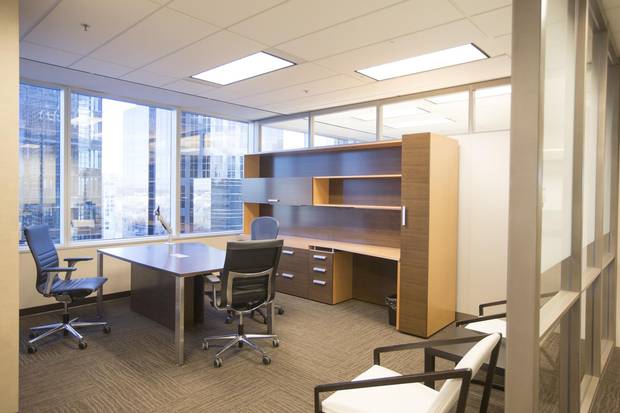 An empty desk at an oil and gas company in downtown Calgary that, with recent layoffs, has had to consolidate its 11 floors into just five.