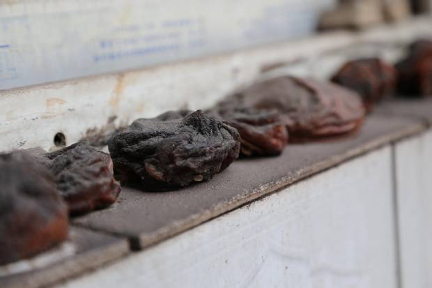Dried persimmons now frequently turn black, which residents say is due to the thick smog that plagues their village.