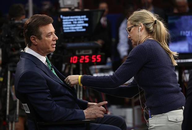 Paul Manafort prepares for an interview on the floor of the Republican National Convention at the Quicken Loans Arena in July.