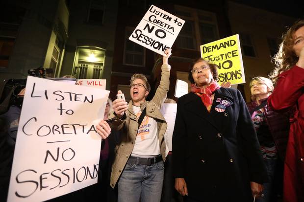 Protesters demonstrate outside the house of Senate Majority Leader Mitch McConnell in Washington ahead of the Senate vote to confirm Jeff Sessions as attorney-general on Feb. 8, 2017.