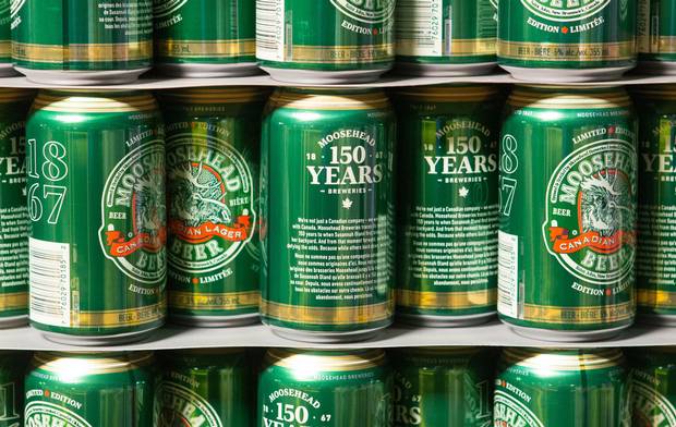 Cans of Moosehead Lager showcasing its original logo wait to be shipped from the company's headquarters in Saint John, N.B.