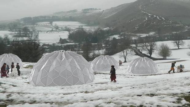 Abeer Seikaly has designed a temporary tent made of what she calls 'structural fabric,' woven together in a pattern that allows it to fold down flat, or pop out the way a circular tissue-paper ornament does.
