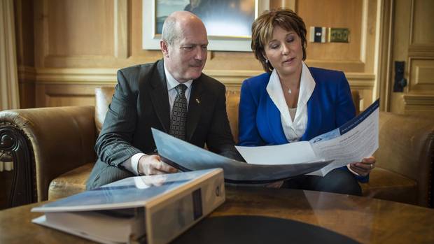 Finance Minister Mike de Jong and Premier Christy Clark look over the budget in the Premier's Victoria office on February 16, 2016, before tabling the budget in the legislature.