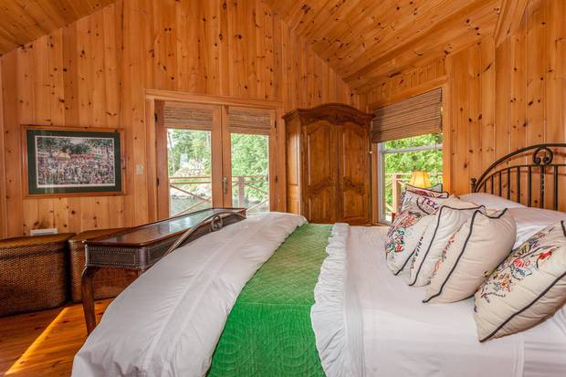 The boathouse quarters provide the owners with privacy when extended family stays in the cottage.