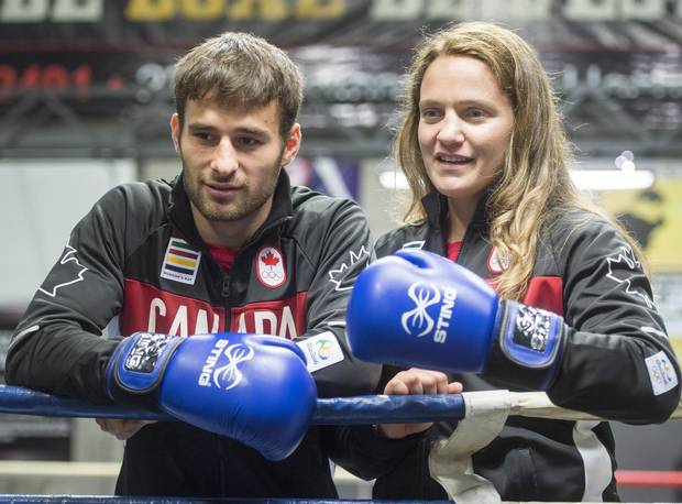 Canadian Olympic Boxing team members Arthur Biyarslanov (64 kg) and Ariane Fortin (75kg) pose for photos after being introduced to the media, in Montreal on Thursday, July 14, 2016. Canada is sending only three boxers to the 2016 Olympics, but Arthur Byarslanov, Mandy Bujold and Ariane Fortin are all medal contenders.