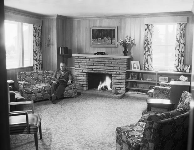 This photograph was commissioned by a manufacturer of pipes for radiant heating. The room may have been chosen to represent a ‘typical’ (or possibly ideal) suburban living room.