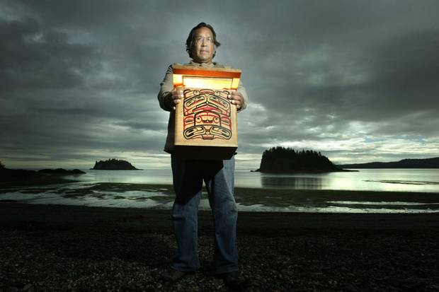 Andy Wilson, shown in Skidegate in 2003, holds one of the 150 traditional bentwood boxes holding Haida remains being repatriated by the Field Museum for burial on Haida Gwaii.