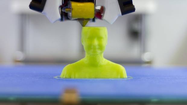 The 3-D printer at work, scanning Peter Simons.
