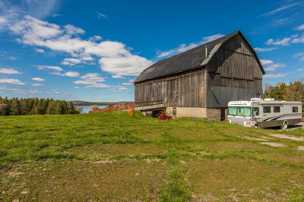 Ronnie Hawkins sold his 175-acre property on Stoney Lake in Ontaraio’s Kawarthas region. The property includes a 5,600-square-foot residence, two guest cottages on a peninsula, an event barn and a stable doubling as a garage.