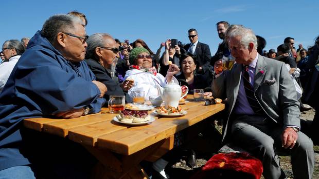 Britain's Prince Charles drinks tea during a tour of Sylvia Grinnell Park in Iqaluit, Nunavut, Canada, June 29, 2017. 