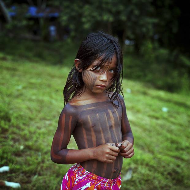 A child from the Xikrin village of Pot crô stands for a photo on the banks of the Rio Bacaja, its name meaning 