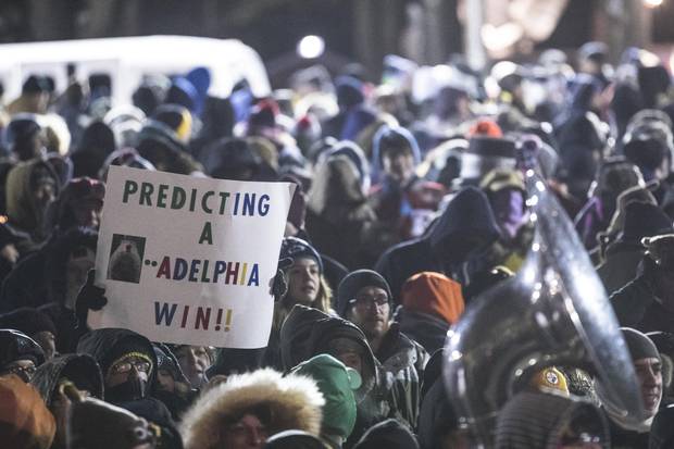 A Philadelphia Eagles fan holds a sign in support of the team during ceremonies for Groundhog Day on Feb. 2, 2018.