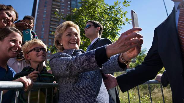 Hillary Clinton takes a selfie with supporters in Des Moines, Iowa, on Sept. 29, 2016.