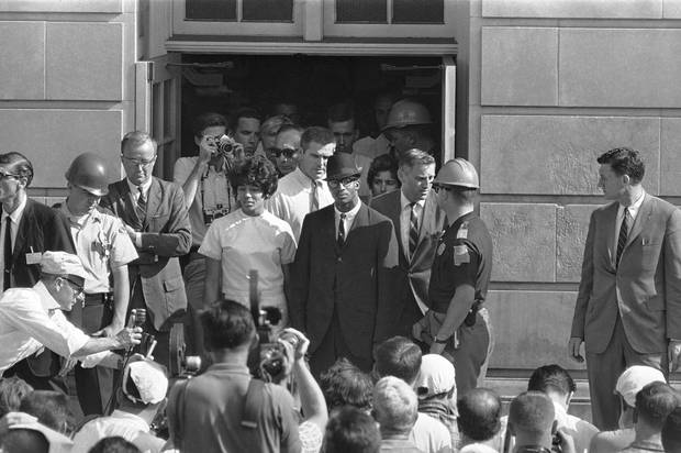 In this June 11, 1963 file photo, Vivian Malone and James Hood stand in the doorway of Foster Auditorium where they hold what they called their 