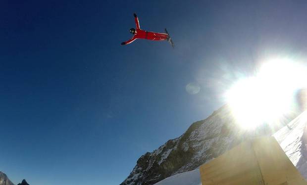 This photo taken from a 4K video and dated Tuesday, Oct. 17, 2017 shows Swiss aerial skier Mischa Gasser as he performs a jump during training on the glacier above Saas-Fee, Switzerland.
