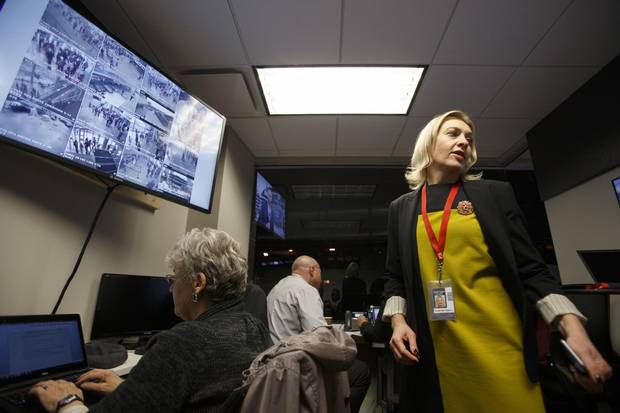 Rogers Place vice president and general manager Susan Darrington, right, keeps an eye on all situations in the arena's venue command centre before an Edmonton Oilers pre-season game in Edmonton, Alta., on Tuesday, Oct. 4, 2016.