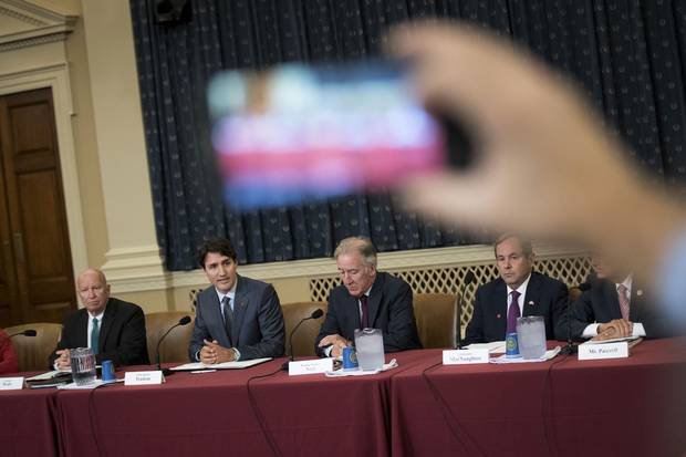 Republican congressman Kevin Brady, Mr. Trudeau, Democratic congressman Richard Neal and Canadian ambassador to the United States David MacNaughton attend a meeting with the House ways and Means committee.
