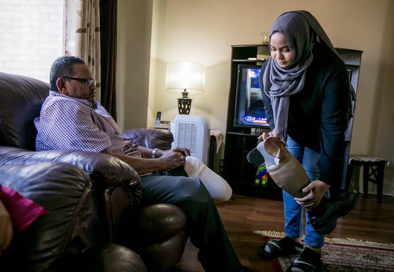 Hana Hussein, 20, helps out her father, who lost his legs as a result of diabetes. She has no regrets being a young caregiver. ‘I knew things that most nine-year-olds wouldn’t know, like what insulin is and how to inject it. It’s made me more mature.”