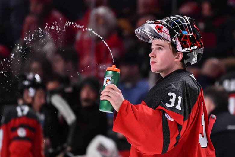 Carter Hart of Team Canada sprays water during the 2017 IIHF World Junior Championship semifinal game against Team Sweden at the Bell Centre on January 4, 2017 in Montreal, Quebec, Canada. Team Canada defeated Team Sweden 5-2 and move on to the gold medal round.