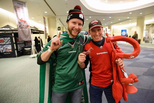 Conrad Brock, left, and his friend Mike Hassel attend Grey Cup fan events at the Metro Toronto Convention Centre on Nov 24 2016. Brock is wearing the colours of the Saskatchewan Roughriders and Mike is wearing Calgary Stampeders colours. The 104th Grey Cup will be played between the Calgary Stampeders and the Ottawa redBlacks this weekend.